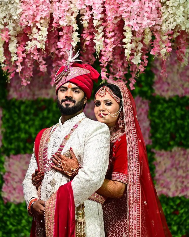Happy Indian wedding couple representing successful Love Marriage with guidance from Astrologer Laxmikant Shastri.